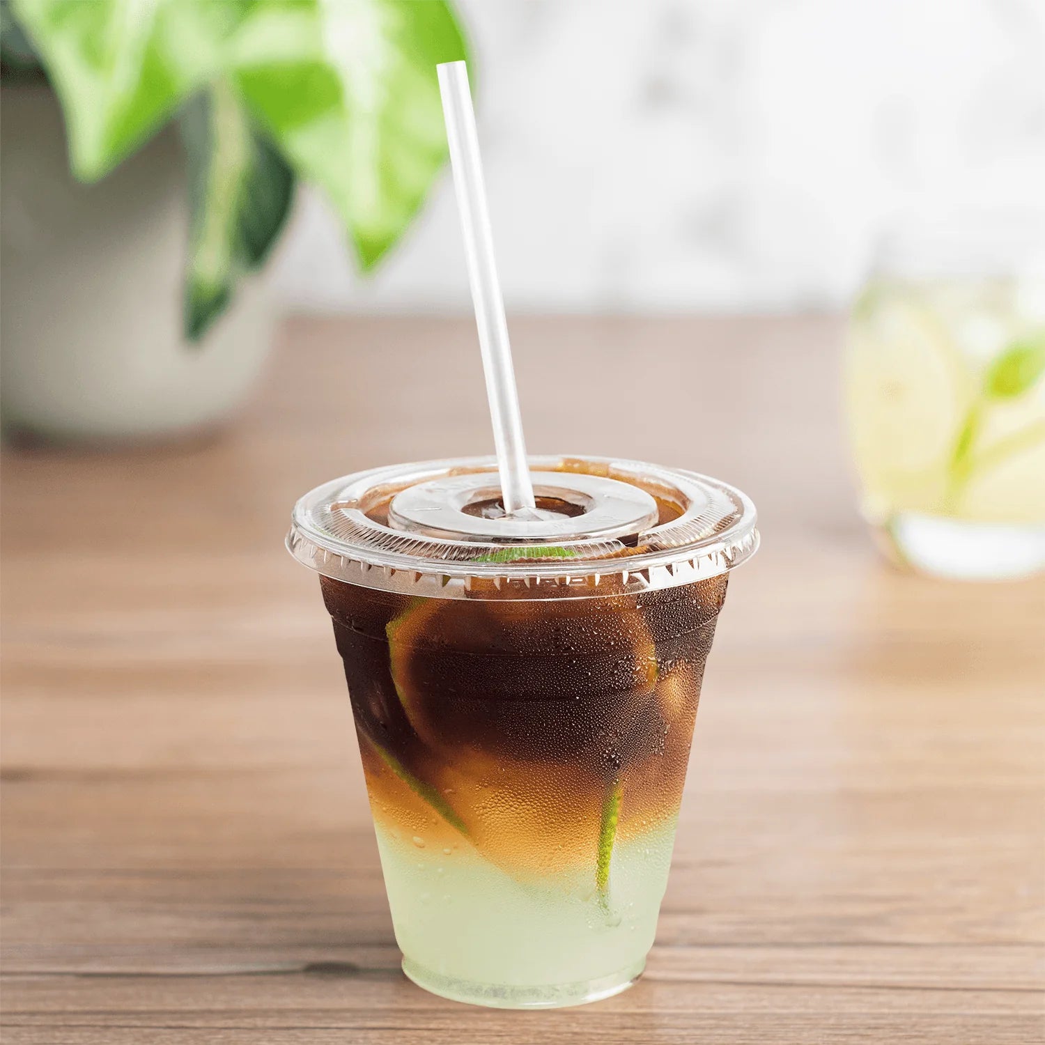 12 oz clear PET cold drink cup filled with iced coffee – recyclable plastic cup for foodservice use.