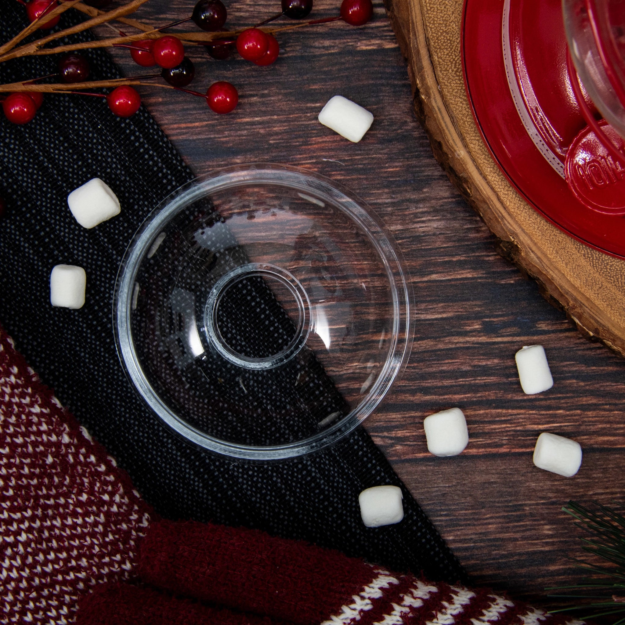 Clear PET dome lid (98 mm) for cold cups, styled on a wood table with red berries and scattered marshmallows