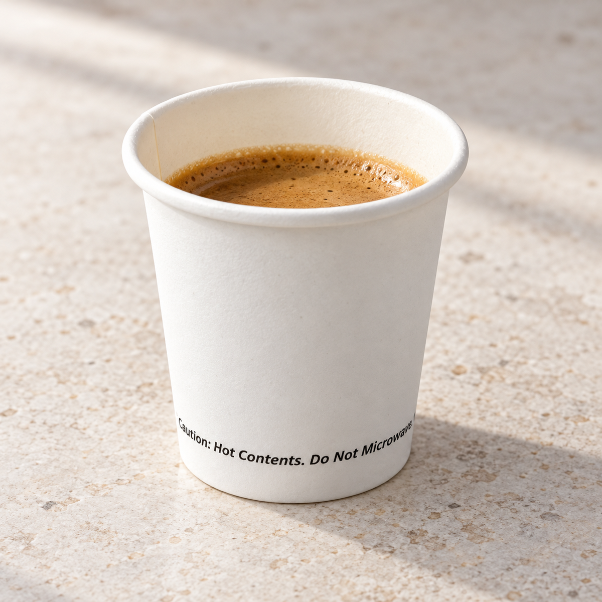 Jovials 4 oz white paper hot cup serving espresso; beverage not included
