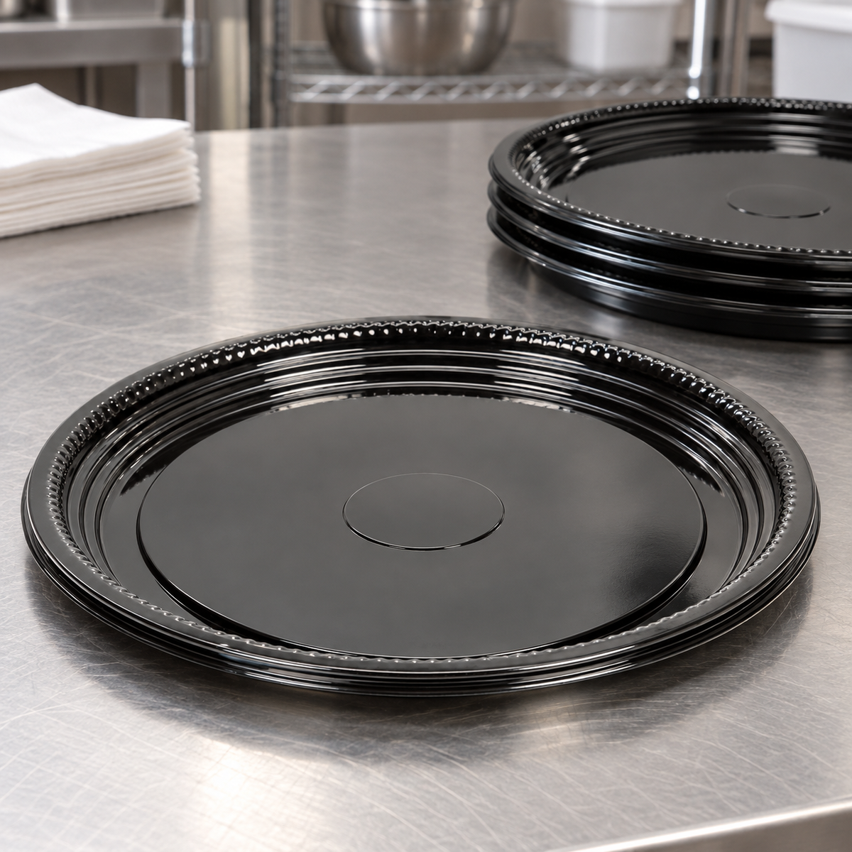 WNA A512PBL black PET catering trays on a restaurant preparation counter