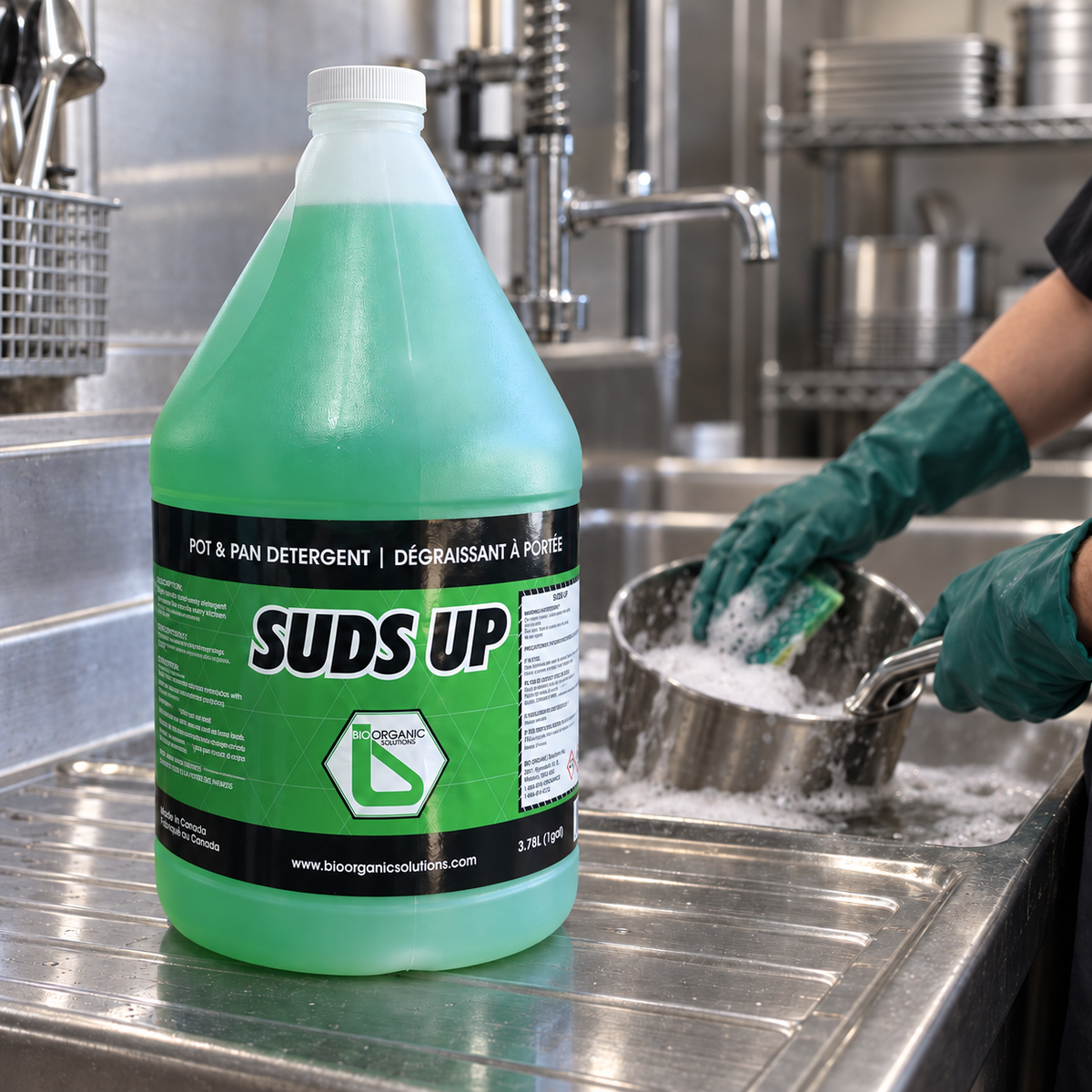 Suds Up 1-gallon detergent jug beside a commercial sink during manual pot washing, AI-assisted scene